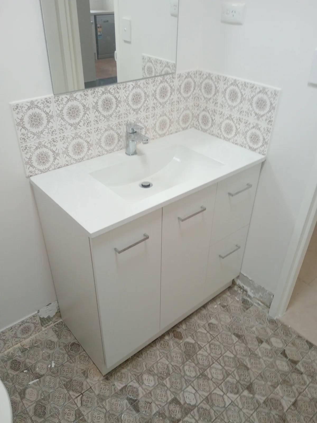New bathroom vanity and basin installed