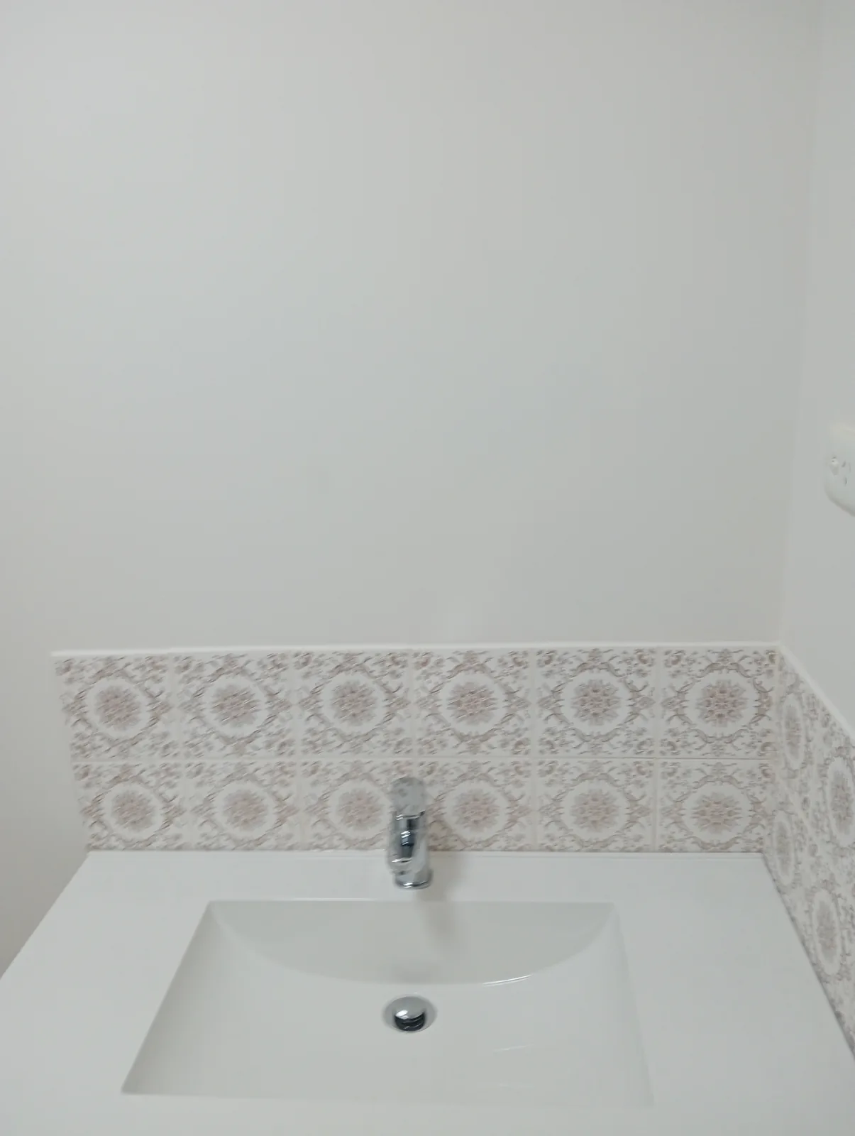 Bathroom basin before vanity replacement